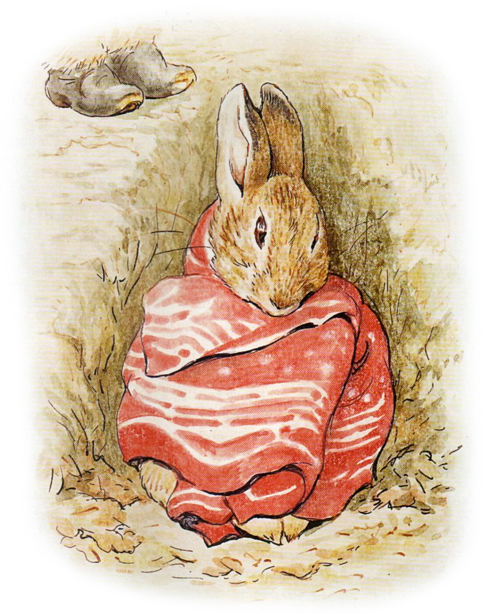 Кролик сидит под одеялом